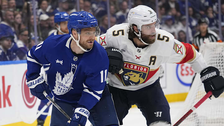 May 18, 2025; Toronto, Ontario, CAN; Toronto Maple Leafs forward Max Domi (11) and Florida Panthers defenseman Aaron Ekblad (5) battle for position during the third period of game seven of the second round of the 2025 Stanley Cup Playoffs at Scotiabank Arena. Mandatory Credit: John E. Sokolowski-Imagn Images May 18, 2025; Toronto, Ontario, CAN; Toronto Maple Leafs forward Max Domi (11) and Florida Panthers defenseman Aaron Ekblad (5) battle for position during the third period of game seven of the second round of the 2025 Stanley Cup Playoffs at Scotiabank Arena. Mandatory Credit: John E. Sokolowski-Imagn Images