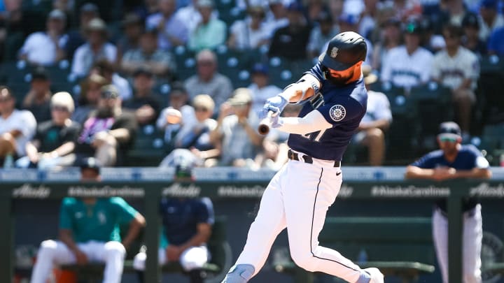 Seattle Mariners left fielder Jesse Winker (27) hits a single against the Cleveland Guardians during the first inning at T-Mobile Park in 2022.