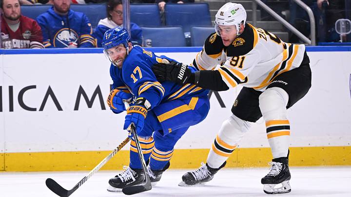 January 28th, 2025; Buffalo, New York, USA;  Buffalo Sabres winger Jason Zucker (17) battles for the puck against Boston Bruins defencemen Nikita Zadorov (91). 