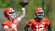 Cleveland Browns quarterback Shedeur Sanders watches as quarterback Dillon Gabriel throws during rookie minicamp