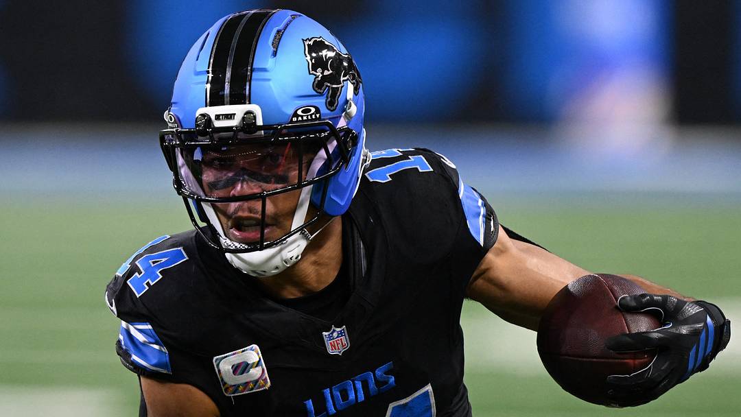 Oct 25, 2026; Detroit, Michigan, USA;  Detroit Lions wide receiver Amon-Ra St. Brown (14) runs the ball for a first down inside the 2 minute warming during the second quarter against the Green Bay Packers at Ford Field.  Mandatory Credit: Lon Horwedel-Imagn Images