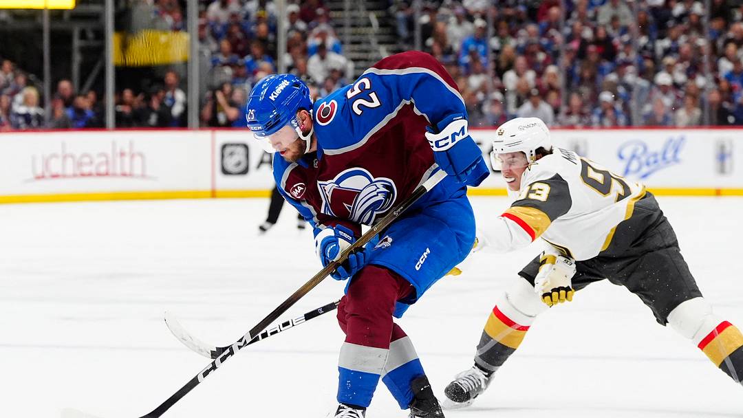 May 22, 2026; Denver, Colorado, USA; Colorado Avalanche right wing Logan O'Connor (25) and Vegas Golden Knights right wing Mitch Marner (93) battle for control of the puck during the second period of game two of the Western Conference Final of the 2026 Stanley Cup Playoffs at Ball Arena. Mandatory Credit: Ron Chenoy-Imagn Images