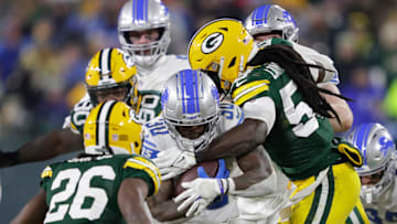 Detroit Lions running back Jamaal Williams (30) is tackled by Green Bay Packers linebacker De'Vondre Campbell (59) as safety Darnell Savage (26) moves in on the play during their football game Sunday, January 8, 2023, at Lambeau Field in Green Bay, Wis. Dan Powers/USA TODAY NETWORK-Wisconsin

Apc Packvsdetroit 0108232191djp