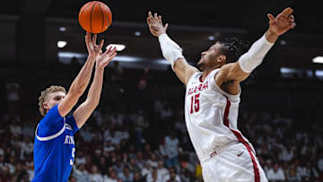 Feb 22, 2025; Tuscaloosa, Alabama, USA; Kentucky Wildcats guard Collin Chandler (5) shoots against Alabama Crimson Tide forward Jarin Stevenson (15) during the second half at Coleman Coliseum. Mandatory Credit: Will McLelland-Imagn Images