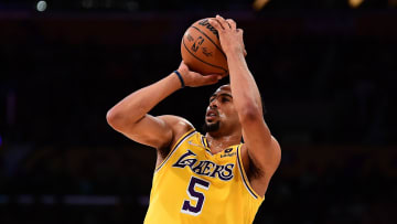 Mar 14, 2022; Los Angeles, California, USA; Los Angeles Lakers guard Talen Horton-Tucker (5) shoots against the Toronto Raptors during the second half at Crypto.com Arena. Mandatory Credit: Gary A. Vasquez-USA TODAY Sports