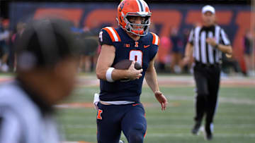 Oct 12, 2024; Champaign, Illinois, USA;  Illinois Fighting Illini quarterback Luke Altmyer (9) runs with the ball in the second half against the Purdue Boilermakers at Memorial Stadium. Mandatory Credit: Ron Johnson-Imagn Images