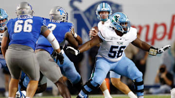 Oct 13, 2023; Memphis, Tennessee, USA; Tulane Green Wave offensive linemen Shadre Hurst (56) blocks during the first half against the Memphis Tigers at Simmons Bank Liberty Stadium. 