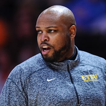 Dec 20, 2021; Knoxville, Tennessee, USA; East Tennessee State Lady Buccaneers head coach Simon Harris coaches during the first half against the Tennessee Lady Vols at Thompson-Boling Arena. 