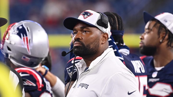 August 8, 2024; Foxborough, MA, USA;  New England Patriots head coach Jerod Mayo watches the video boards after challenging a call on the field during the second half against the Carolina Panthers at Gillette Stadium. Mandatory Credit: Eric Canha-USA TODAY Sports