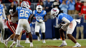 Oct 7, 2023; Oxford, Mississippi, USA; Mississippi Rebels defensive back John Saunders Jr. (5) intercepts the ball during the second half against the Arkansas Razorbacks at Vaught-Hemingway Stadium. Mandatory Credit: Petre Thomas-USA TODAY Sports