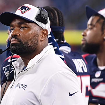 August 8, 2024; Foxborough, MA, USA;  New England Patriots head coach Jerod Mayo watches the video boards after challenging a call on the field during the second half against the Carolina Panthers at Gillette Stadium. Mandatory Credit: Eric Canha-Imagn Images