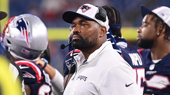 August 8, 2024; Foxborough, MA, USA;  New England Patriots head coach Jerod Mayo watches the video boards after challenging a call on the field during the second half against the Carolina Panthers at Gillette Stadium. Mandatory Credit: Eric Canha-Imagn Images