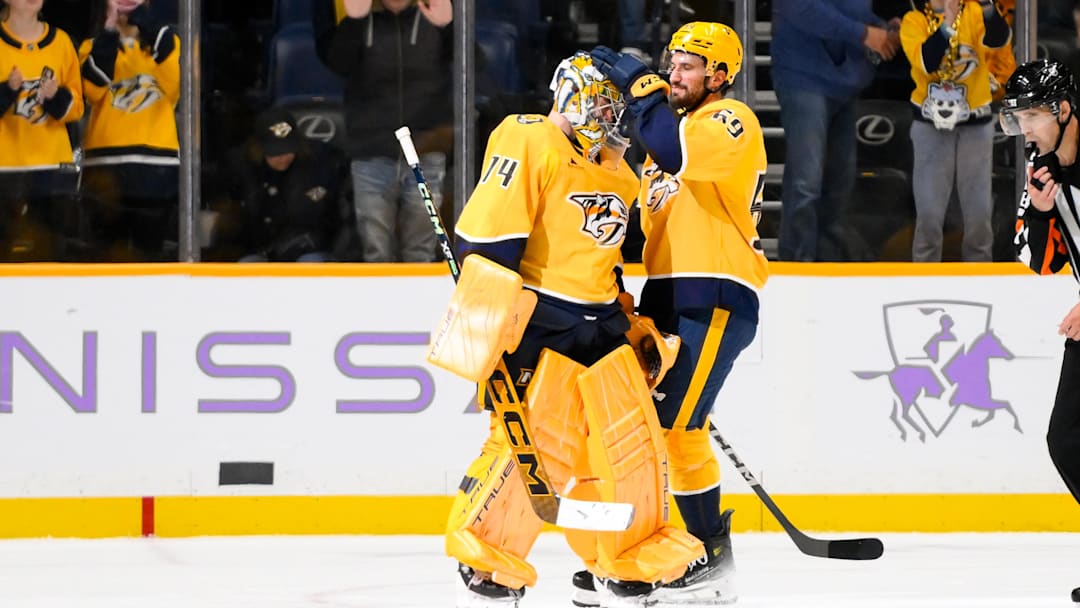 Nov 9, 2024; Nashville, Tennessee, USA;  Nashville Predators defenseman Roman Josi (59) congratulates goaltender Juuse Saros (74) on the win against the Utah Hockey Club during the third period at Bridgestone Arena. Mandatory Credit: Steve Roberts-Imagn Images