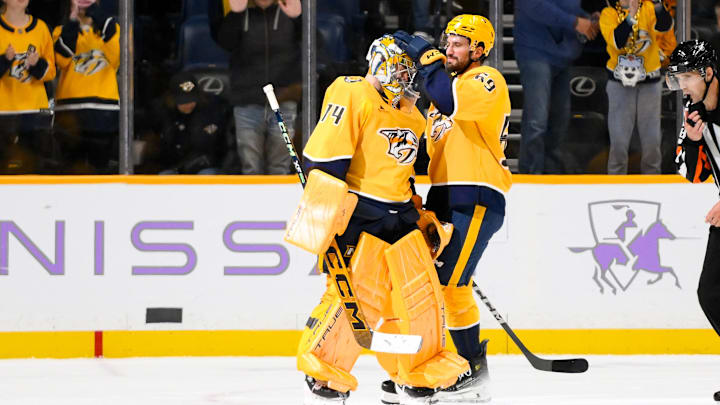 Nov 9, 2024; Nashville, Tennessee, USA;  Nashville Predators defenseman Roman Josi (59) congratulates goaltender Juuse Saros (74) on the win against the Utah Hockey Club during the third period at Bridgestone Arena. Mandatory Credit: Steve Roberts-Imagn Images