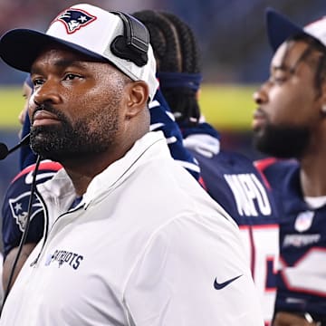 August 8, 2024; Foxborough, MA, USA;  New England Patriots head coach Jerod Mayo watches the video boards after challenging a call on the field during the second half against the Carolina Panthers at Gillette Stadium.