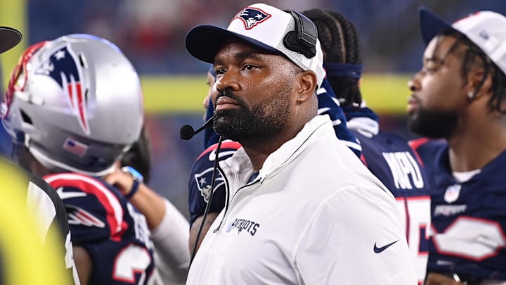 August 8, 2024; Foxborough, MA, USA;  New England Patriots head coach Jerod Mayo watches the video boards after challenging a call on the field during the second half against the Carolina Panthers at Gillette Stadium.