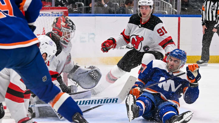 Mar 24, 2024; Elmont, New York, USA;  New York Islanders center Kyle Palmieri (21) falls to the ice