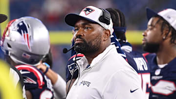 August 8, 2024; Foxborough, MA, USA;  New England Patriots head coach Jerod Mayo watches the video boards after challenging a call on the field during the second half against the Carolina Panthers at Gillette Stadium. Mandatory Credit: Eric Canha-USA TODAY Sports