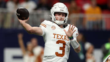 Dec 7, 2024; Atlanta, GA, USA; Texas Longhorns quarterback Quinn Ewers (3) drops back to pass against the Georgia Bulldogs during the first half in the 2024 SEC Championship game at Mercedes-Benz Stadium. Mandatory Credit: Brett Davis-Imagn Images