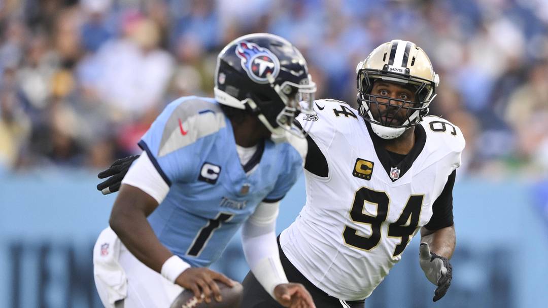 Dec 28, 2025; Nashville, Tennessee, USA; New Orleans Saints defensive end Cameron Jordan (94) gives chase to Tennessee Titans quarterback Cam Ward (1) during the second half of the game at Nissan Stadium. Mandatory Credit: Steve Roberts-Imagn Images Dec 28, 2025; Nashville, Tennessee, USA; New Orleans Saints defensive end Cameron Jordan (94) gives chase to Tennessee Titans quarterback Cam Ward (1) during the second half of the game at Nissan Stadium. Mandatory Credit: Steve Roberts-Imagn Images