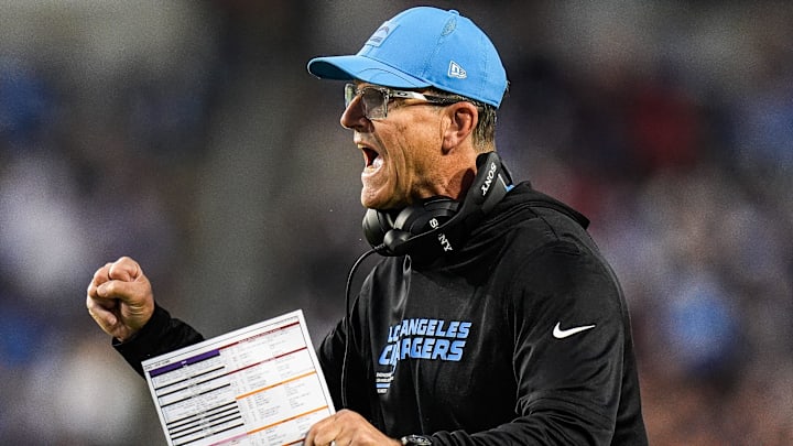 LA Chargers head coach Jim Harbaugh celebrates a touchdown against Detroit Lions during the first half of the Hall of Fame Game at Tom Benson Hall of Fame Stadium in Canton, Ohio on Thursday, July 31, 2025.