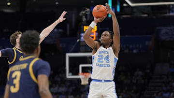 Mar 12, 2025; Charlotte, NC, USA; North Carolina Tar Heels forward Jae'Lyn Withers (24) shoots from long range against the Notre Dame Fighting Irish during the second half at Spectrum Center. Mandatory Credit: Jim Dedmon-Imagn Images