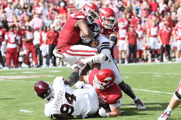 Arkansas quarterback KJ Jefferson gets crushed by the Mississippi State defense.