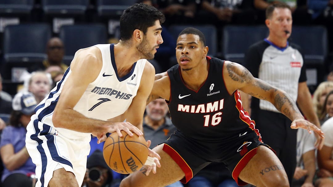 Oct 18, 2024; Memphis, Tennessee, USA; Memphis Grizzlies forward Santi Aldama (7) dribbles as Miami Heat forward Keshad Johnson (16) defends during the first half at FedExForum Oct 18, 2024; Memphis, Tennessee, USA; Memphis Grizzlies forward Santi Aldama (7) dribbles as Miami Heat forward Keshad Johnson (16) defends during the first half at FedExForum