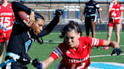 Woodland Hills' Serena Bruce, attempts to elude a Jeannette defender Sunday at Woodland Hills High School.