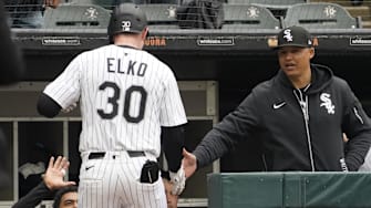 Chicago White Sox first baseman Tim Elko (30) celebrates with manager Will Venable (1) after hitting a home run against the Seattle Mariners at Rate Field.