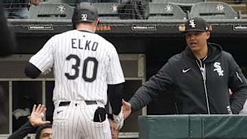 Chicago White Sox first baseman Tim Elko (30) celebrates with manager Will Venable (1) after hitting a home run against the Seattle Mariners at Rate Field.