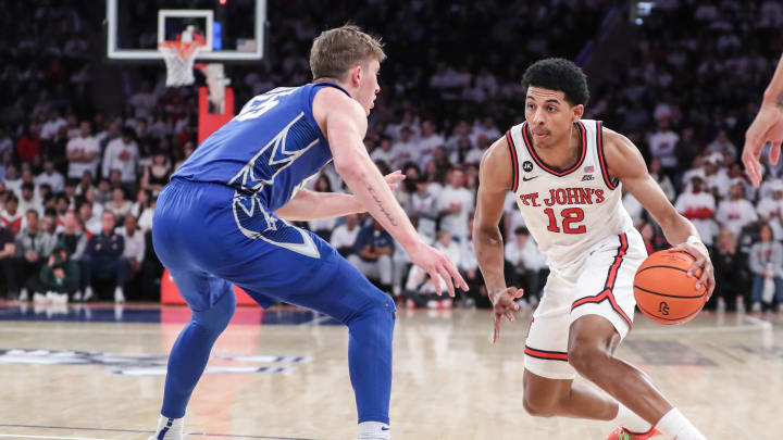 Feb 25, 2024; New York, New York, USA;  St. John's basketball forward RJ Luis Jr. (12) looks to drive past Creighton Bluejays guard Baylor Scheierman