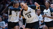 Purdue redshirt sophomore Rachel Williams (1) and senior Akasha Anderson (13) celebrate after a win