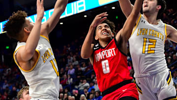 Taylen Kinney (0) scores for Newport in opening-round action at the KHSAA Sweet 16 state basketball tournament, March 16, 2023.

N 109
