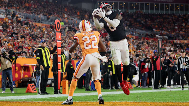 Dec 11, 2025; Tampa, Florida, USA; Atlanta Falcons tight end Kyle Pitts Sr. (8) catches a seventeen-yard touchdown pass thrown by quarterback Kirk Cousins (not pictured) against Tampa Bay Buccaneers cornerback Kindle Vildor (22) during the second quarter at Raymond James Stadium. Mandatory Credit: Nathan Ray Seebeck-Imagn Images