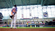 Jul 27, 2025; Houston, Texas, USA; Houston Astros center fielder Taylor Trammell (26) stands during the playing of God Bless America during the seventh inning against the Athletics at Daikin Park. 