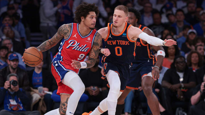 Apr 22, 2024; New York, New York, USA;  Philadelphia 76ers guard Kelly Oubre Jr. (9) dribbles against New York Knicks guard Donte DiVincenzo (0) during the second half during game two of the first round for the 2024 NBA playoffs at Madison Square Garden. Mandatory Credit: Vincent Carchietta-USA TODAY Sports