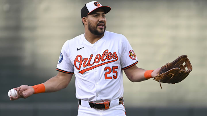 Sep 4, 2024; Baltimore, Maryland, USA;  Baltimore Orioles outfielder Anthony Santander (25) reacts while speaking with teammate sin the field before the game against the Chicago White Sox at Oriole Park at Camden Yards.