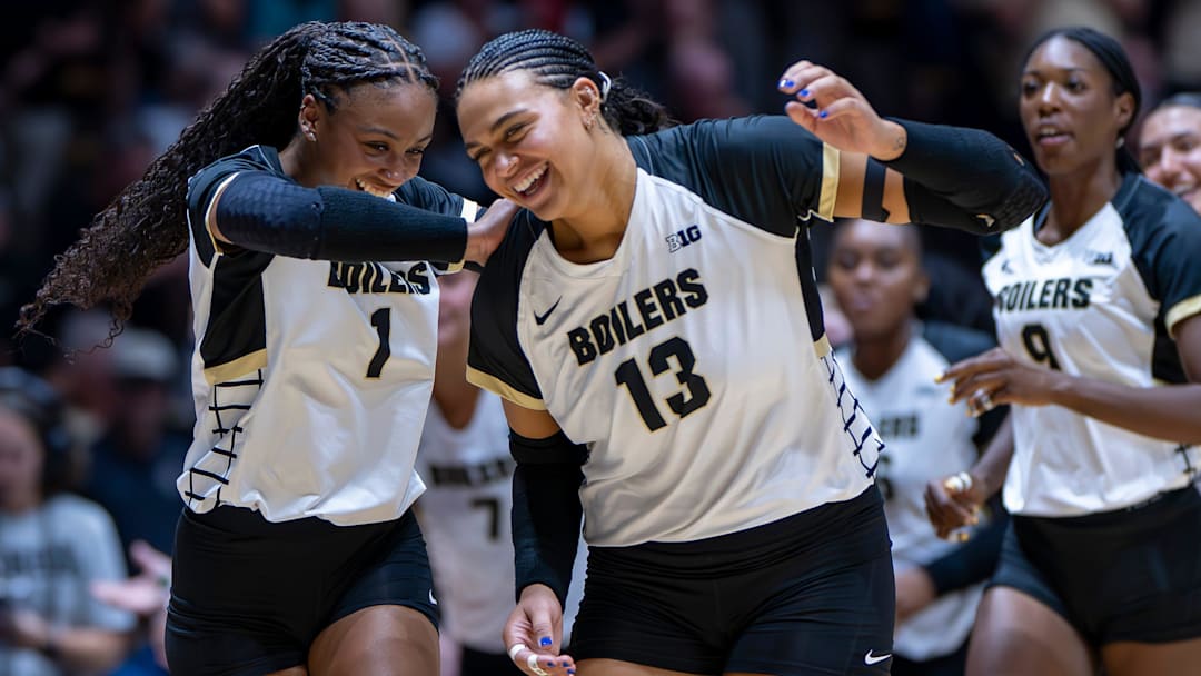 Purdue redshirt sophomore Rachel Williams (1) and Purdue senior Akasha Anderson (13) celebrate after the second set