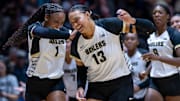Purdue redshirt sophomore Rachel Williams (1) and Purdue senior Akasha Anderson (13) celebrate after the second set