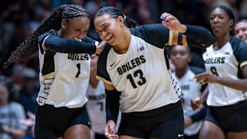 Purdue redshirt sophomore Rachel Williams (1) and Purdue senior Akasha Anderson (13) celebrate after the second set