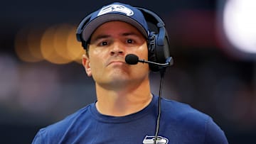 Mike Macdonald of the Seattle Seahawks calls a play