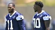 Jul 26, 2023; Oxnard, CA, USA; Dallas Cowboys linebacker Micah Parsons (11) and Dallas Cowboys defensive end DeMarcus Lawrence (90) walk on the field during training camp drill at River Ridge Playing Fields in Oxnard, CA. 