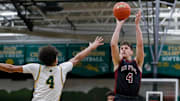 De Pere High School's Zach Kinziger (right) shoots a jump shot against Ashwaubenon High School on Tuesday, February 4, 2025, at Ashwaubenon High School in Ashwaubenon, Wis. De Pere won the game, 70-68, on a Roan Demovsky layup with 1.6 seconds remaining in regulation.
Tork Mason/USA TODAY NETWORK-Wisconsin