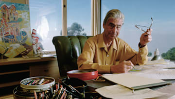 Dr. Seuss Drawing at His Desk
