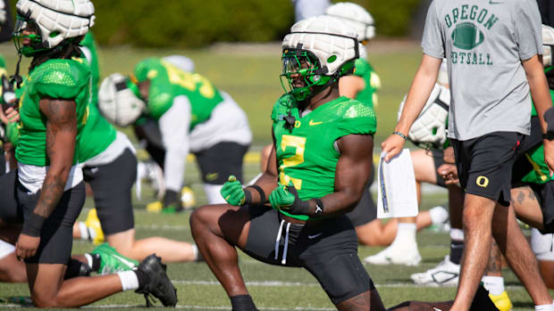 Oregon inside linebacker Jeffrey Bassa works out during practice with the Oregon Ducks