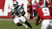 Oct 12, 2024; Tuscaloosa, Alabama, USA;  South Carolina Gamecocks quarterback LaNorris Sellers (16) scrambles for a first down against the Alabama Crimson Tide during the second half at Bryant-Denny Stadium. Mandatory Credit: Butch Dill-Imagn Images