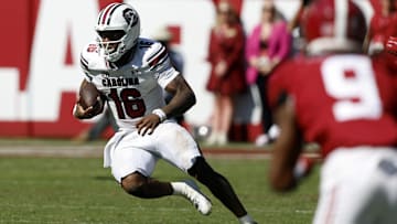 Oct 12, 2024; Tuscaloosa, Alabama, USA;  South Carolina Gamecocks quarterback LaNorris Sellers (16) scrambles for a first down against the Alabama Crimson Tide during the second half at Bryant-Denny Stadium. Mandatory Credit: Butch Dill-Imagn Images