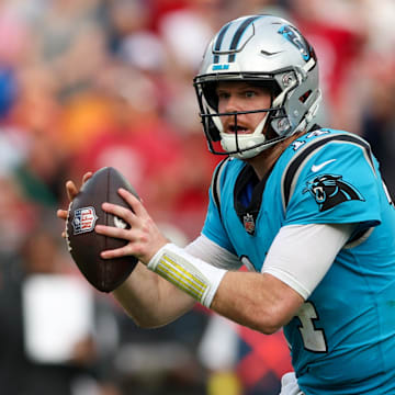 Jan 1, 2023; Tampa, Florida, USA;  Carolina Panthers quarterback Sam Darnold (14) drops back to pass against the Tampa Bay Buccaneers in the fourth quarter at Raymond James Stadium. Mandatory Credit: Nathan Ray Seebeck-Imagn Images