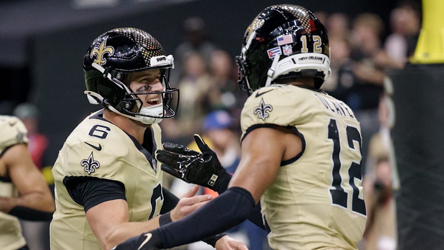 Saints receiver Chris Olave and quarterback Tyler Shough 